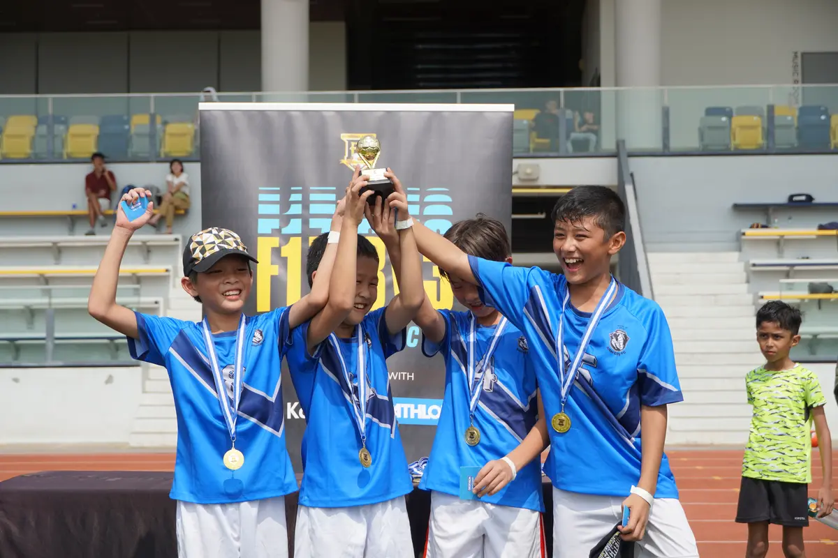 Young champions lifting the F17 3v3 Strikers Cup