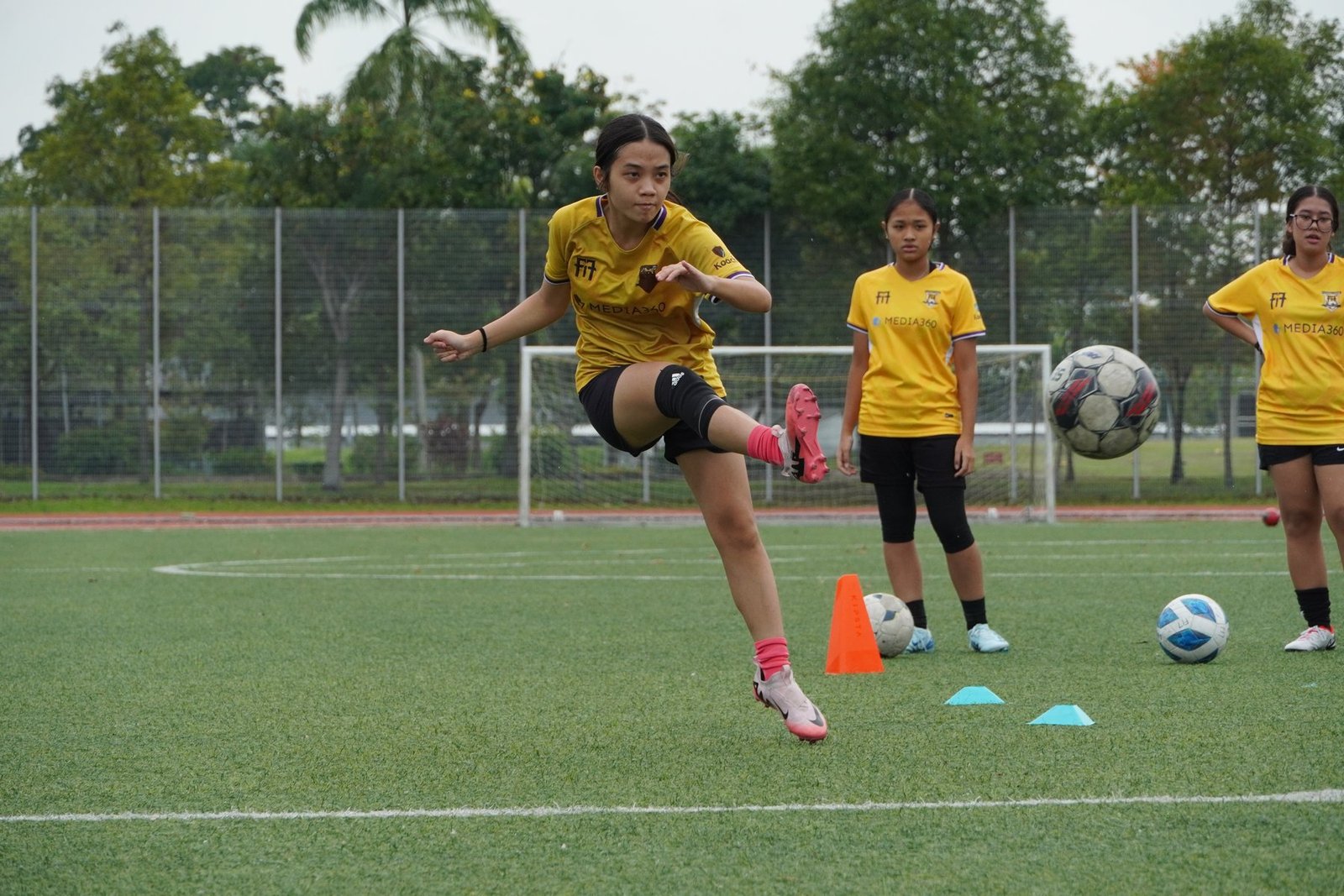 F17 player driving through a cone and finishing movement drill