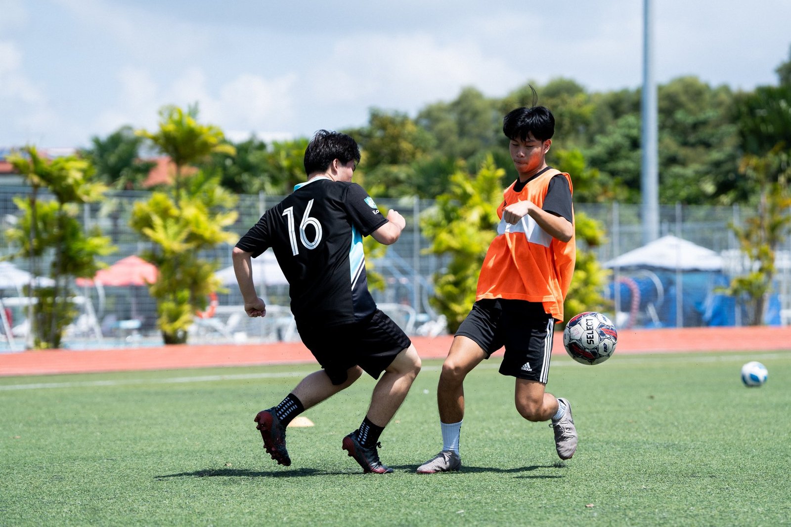 Two F17 players challenging for the ball during training