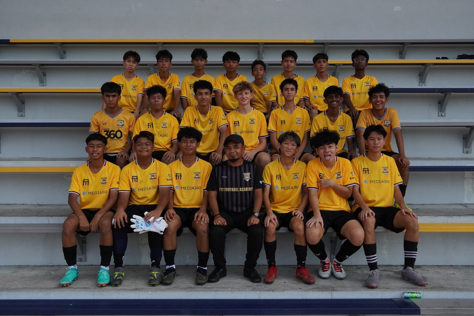F17 players posing together for a team photo after training