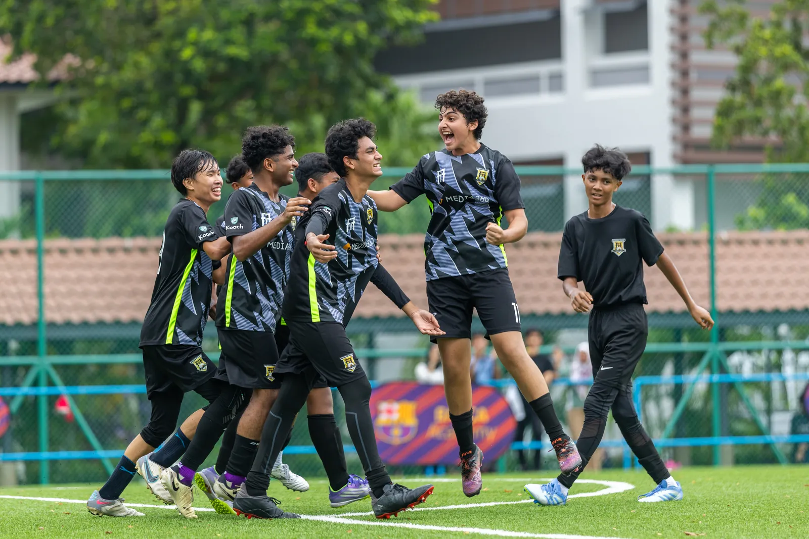 F17 U16 players celebrating together during a match
